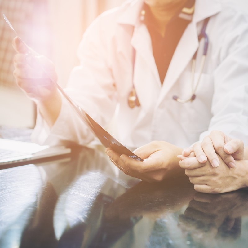 A doctor and patient reviewing information.  