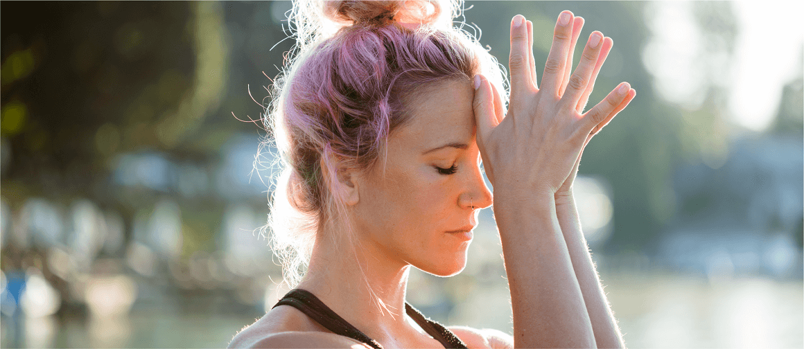 Article 3 AAN21_NPS-TPE-NP-00317_HEADER_1160x500px.png A woman in the park with her thumbs touching her forehead.