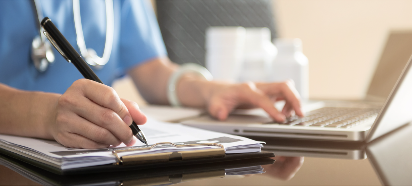 NB Migraine PubPulse 3_NPS-TPE-NP-00310_1150x500px.png Photograph of a doctor filling out on a notepad.