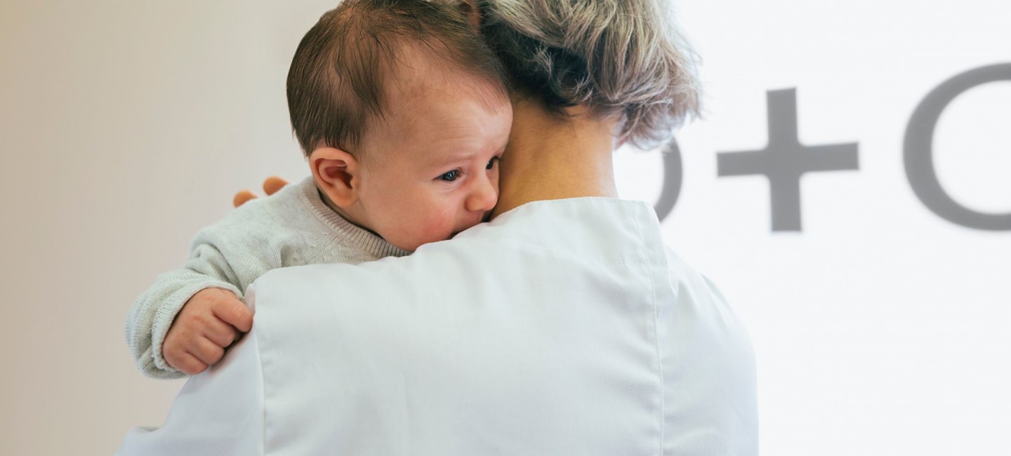 Riskof postpartum2320x1000.jpg A woman holding a baby