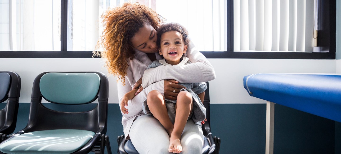 SafetyofMStreatments2320x1000.jpg Parent holding a toddler on her lap