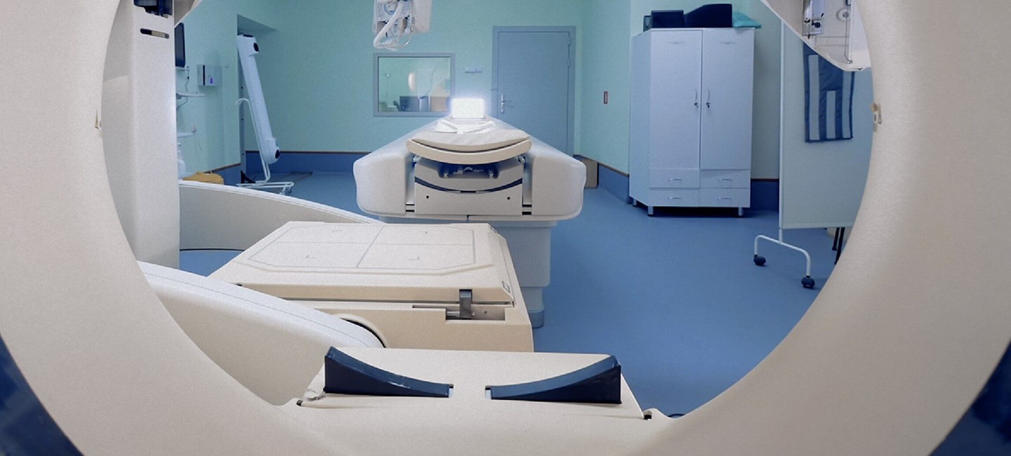 NB_NOW&THEN_Technology_1150x500px_150ppi.jpg View of examination room from MRI scanner